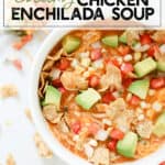 bowl of chicken enchilada soup topped with avocado, tomatoes, cheese, corn, and chips