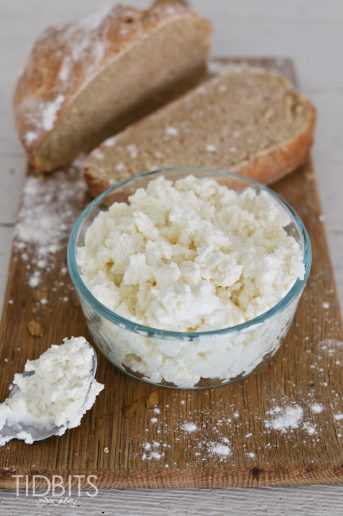 Pressure Cooker Ricotta Cheese in a glass bowl next to crusty bread