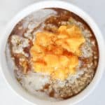 Top down shot of peaches and cream steel cut oats