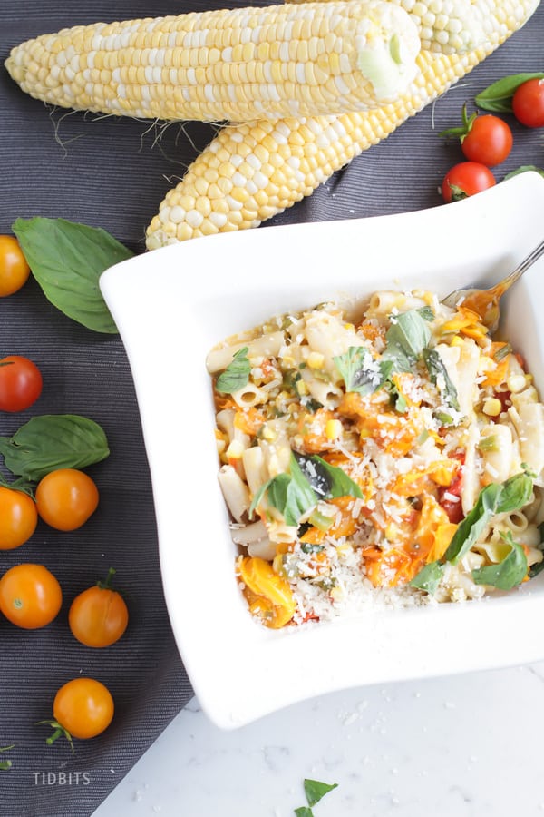 Sweet Corn and Tomato Pasta in a square white bowl