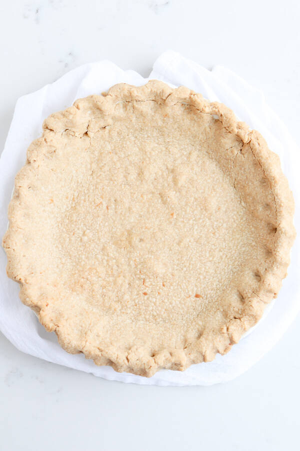 whole wheat pie crust on a white towel