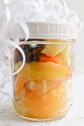 Pressure Cooker Wassail in a jar with a white ribbon