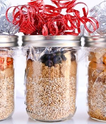 Three jars of Pressure Cooker Steel Cut Oats decorated with ribbon