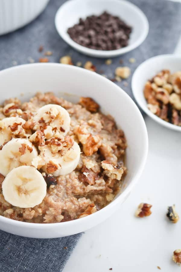 Close up of banana bread steel cut oats in a white bowl