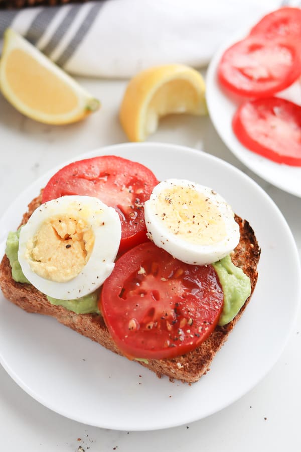 Close up of boiled eggs on an open sandwich