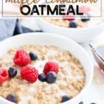 Bowl of oatmeal with cream and berries in a white bowl
