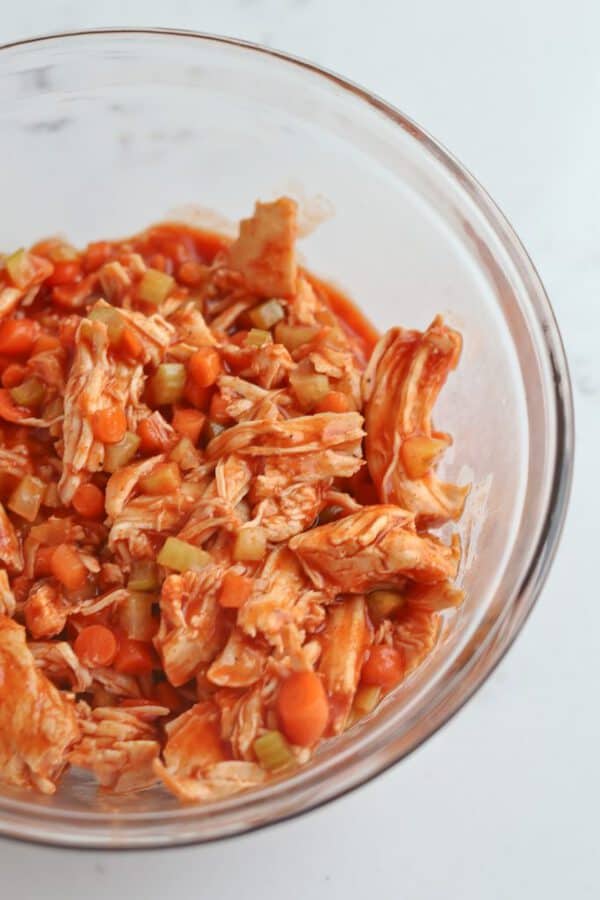 bowl of Instant Pot buffalo chicken, carrots, and celery
