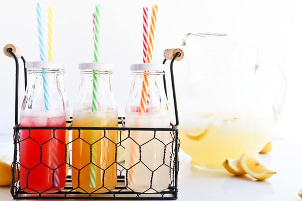 Instant Pot Lemonade in bottles with a straw