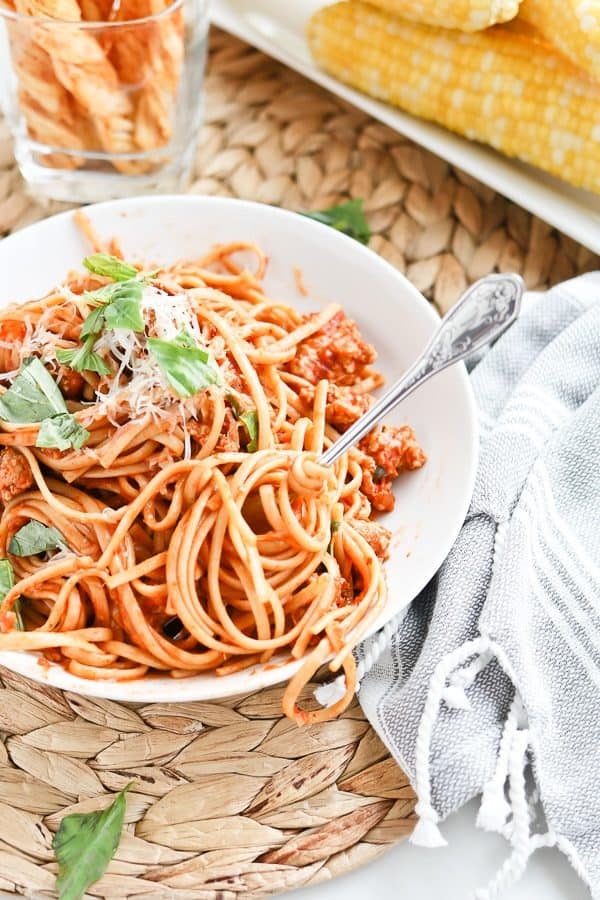 Bowl of spaghetti with fresh basil