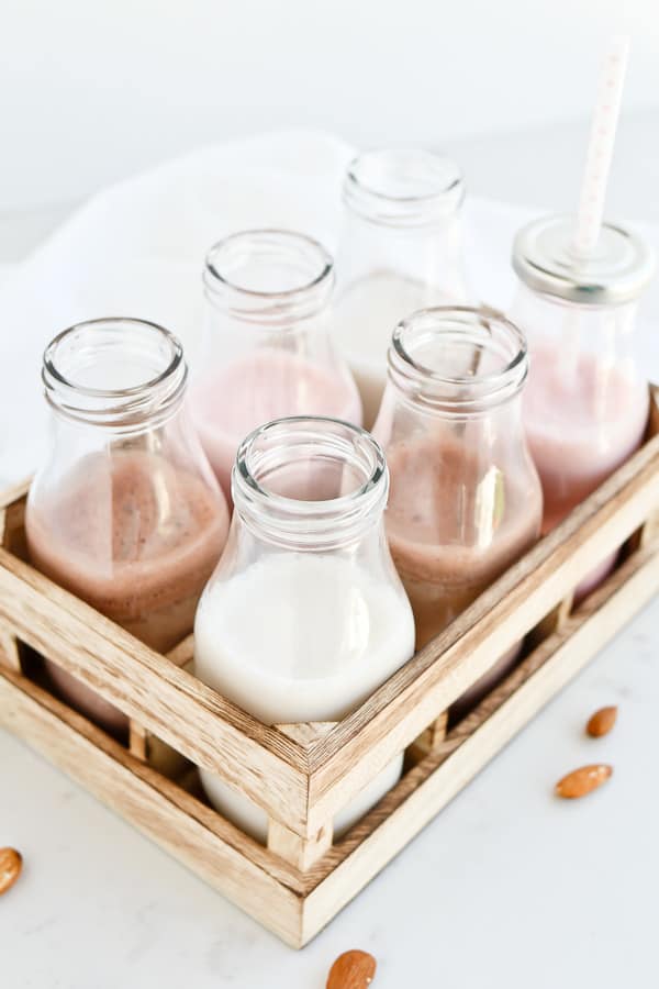 Almond Milk in milk bottles in a crate