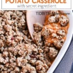 Sweet potato casserole with a pecan crumble in a white dish