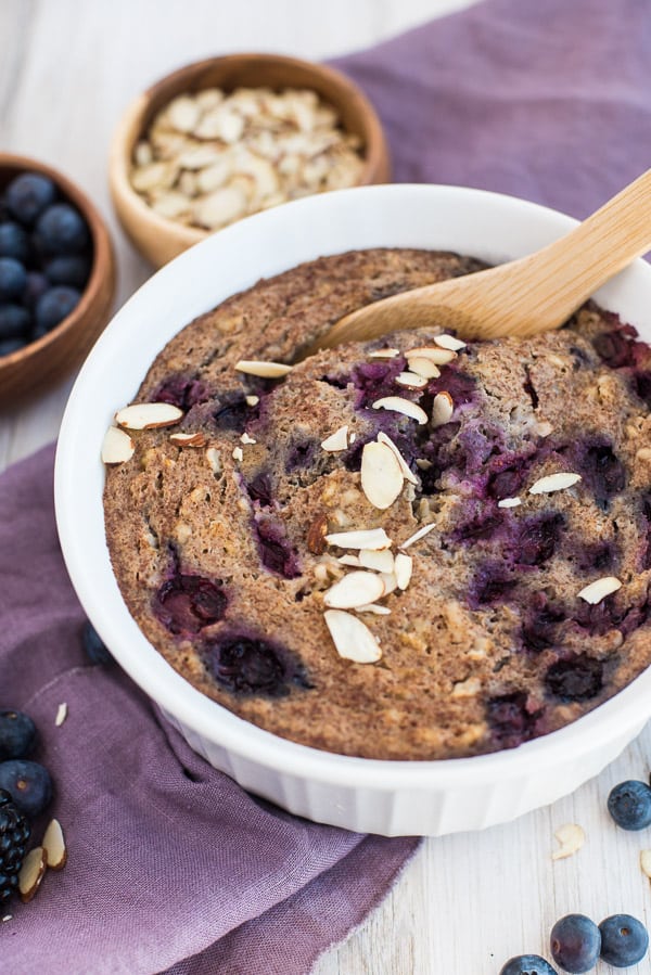 Baking dish with blueberry oatmeal and sliced almonds on top
