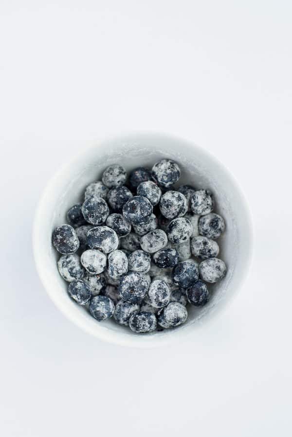 bowl of blueberries coated in flour