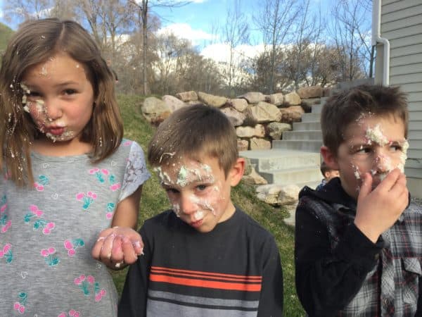 kids with cake on their face