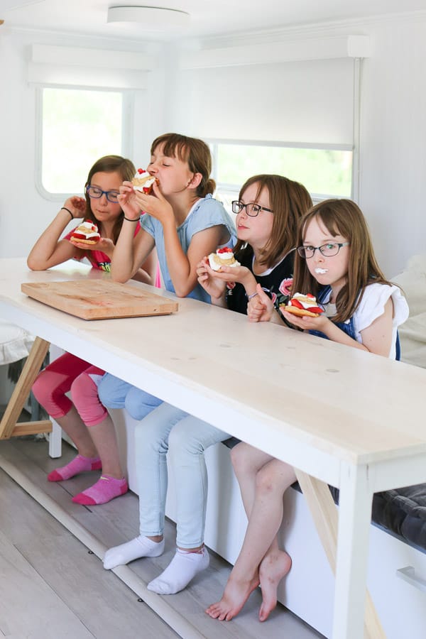 Four girls eating strawberry shortcakes