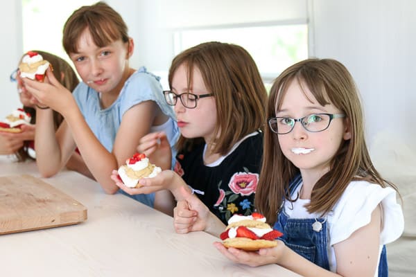 three girls eating strawberry shortcakes