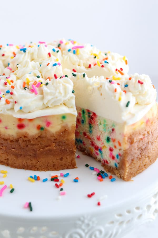 Vanilla cheesecake with oreo crust and colorful sprinkles