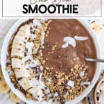 Crio Bru Smoothie in a white bowl with bananas, coconut, and granola