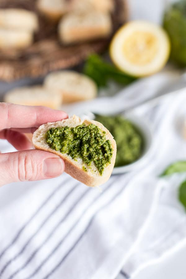 slice of bread with pesto on top
