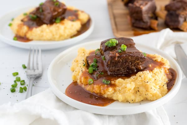 short ribs served over polenta with gravy over top