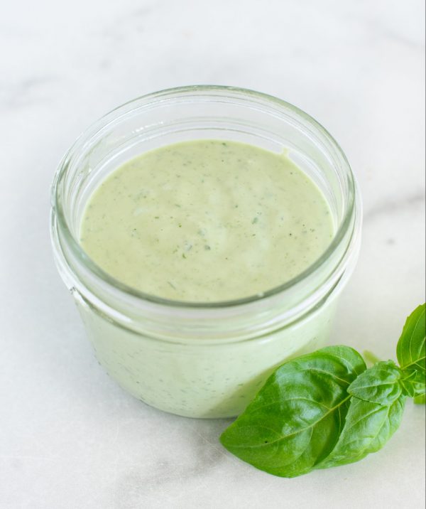 Green basil sauce in a jar